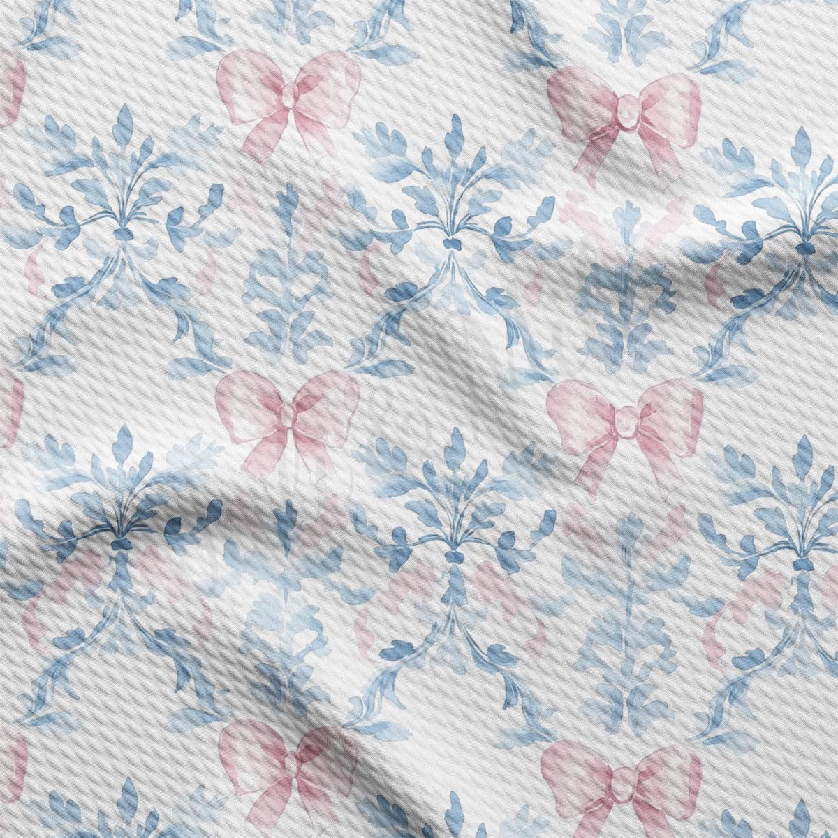 a repeating pattern of pink bows and blue leaves on a white background.