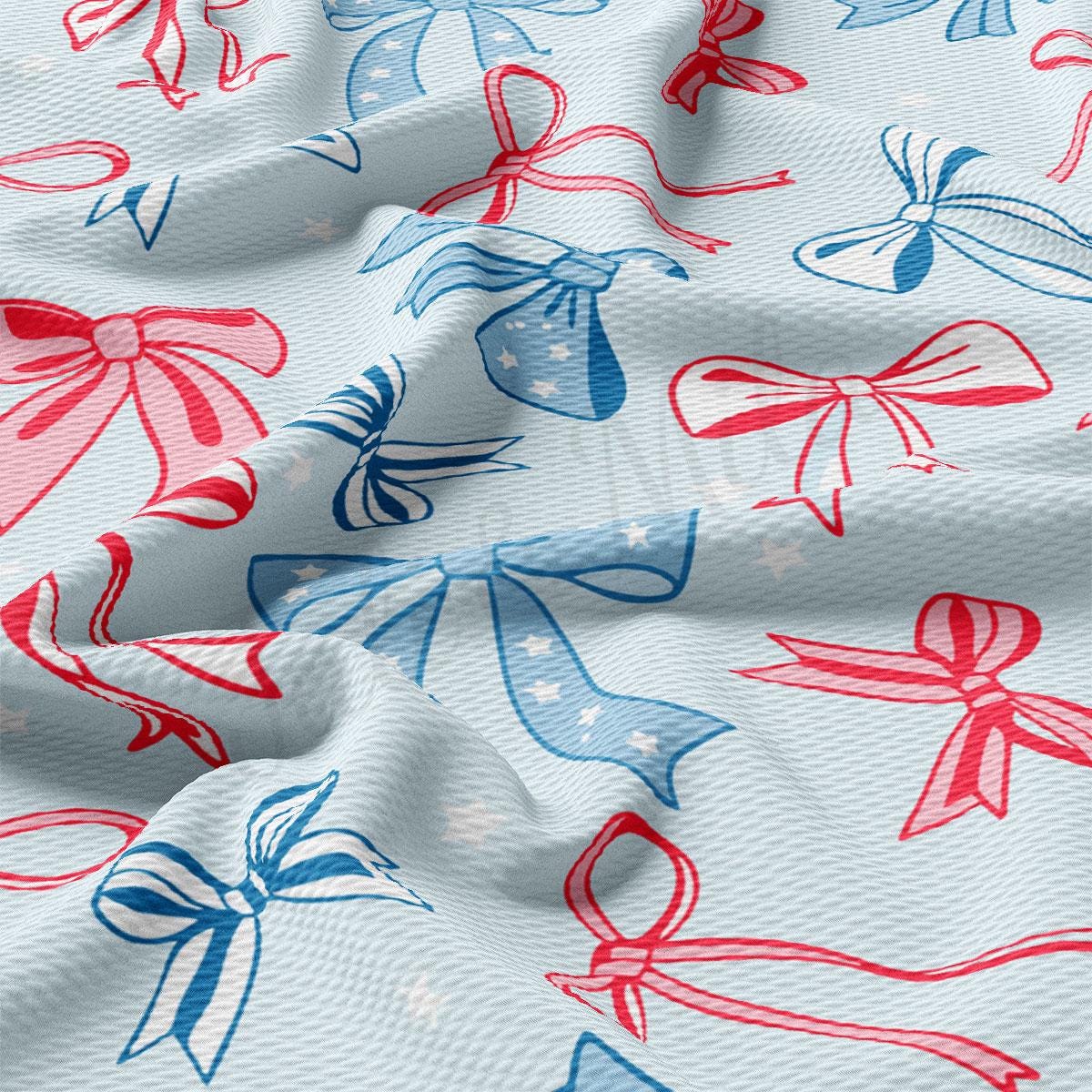 a red, white and blue bow print fabric
