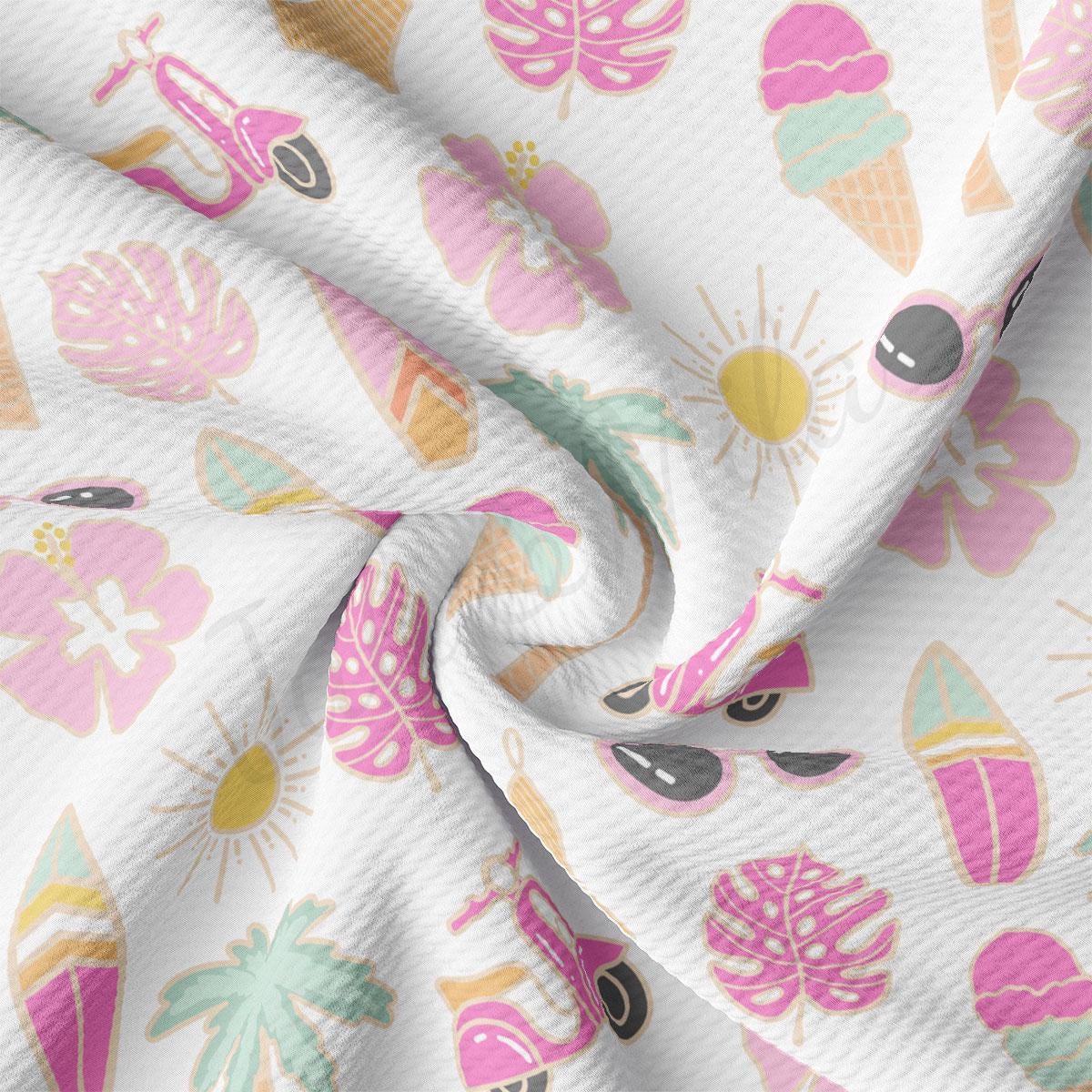 a close up of a white fabric with pink and green designs