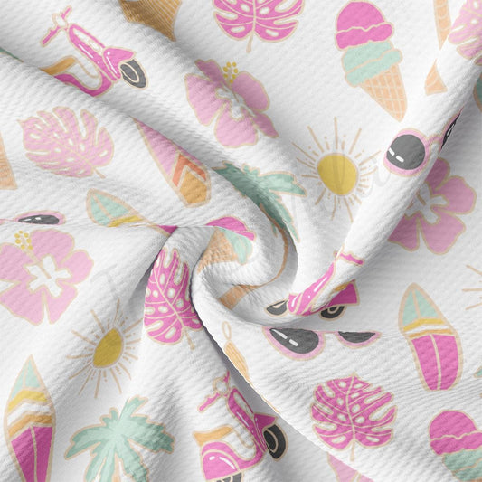 a close up of a white fabric with pink and green designs