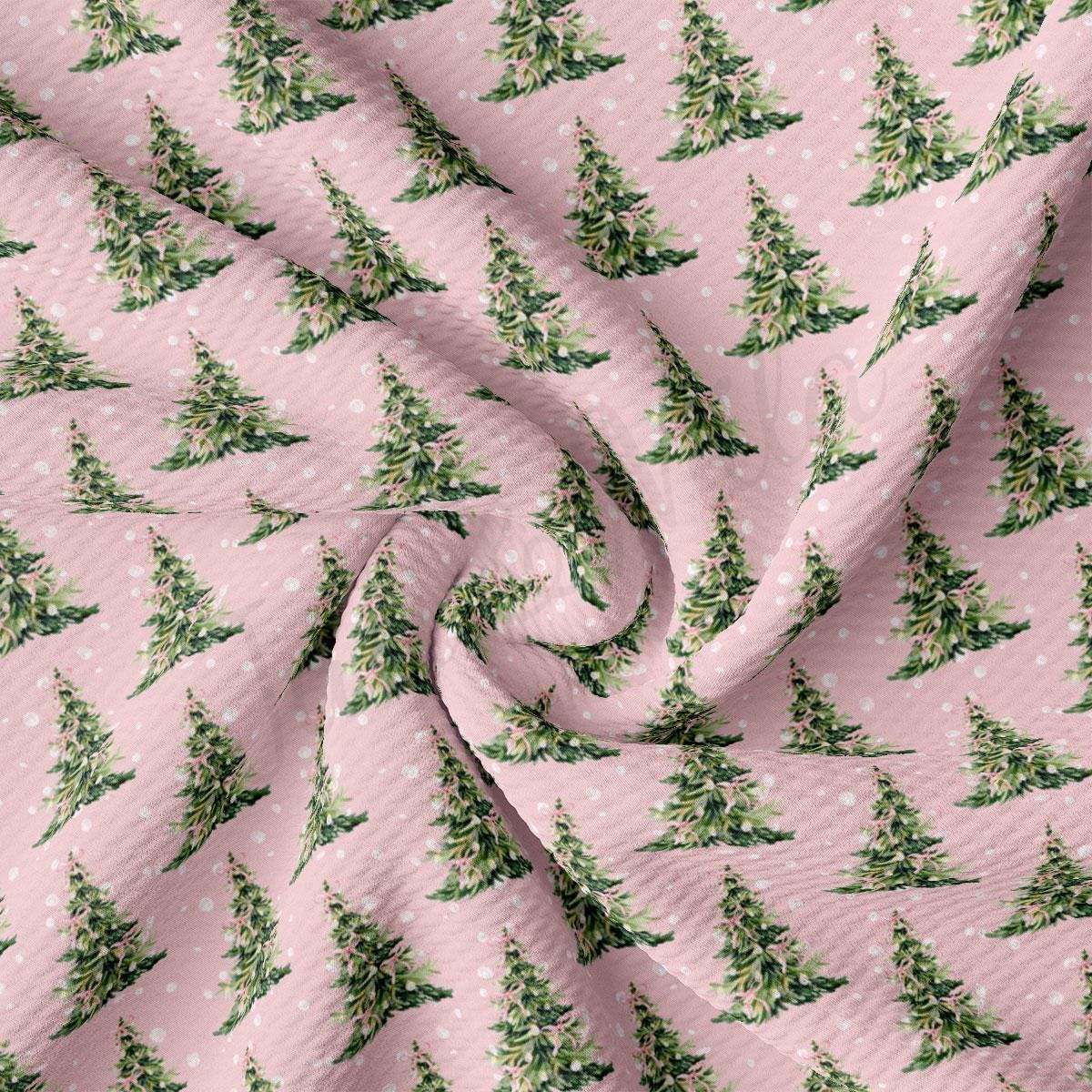 a repeating pattern of green Christmas trees on a pink background.