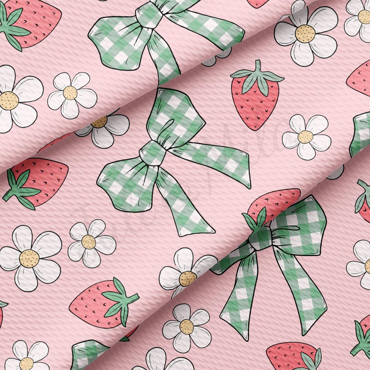a pink background with a pattern of strawberries and flowers