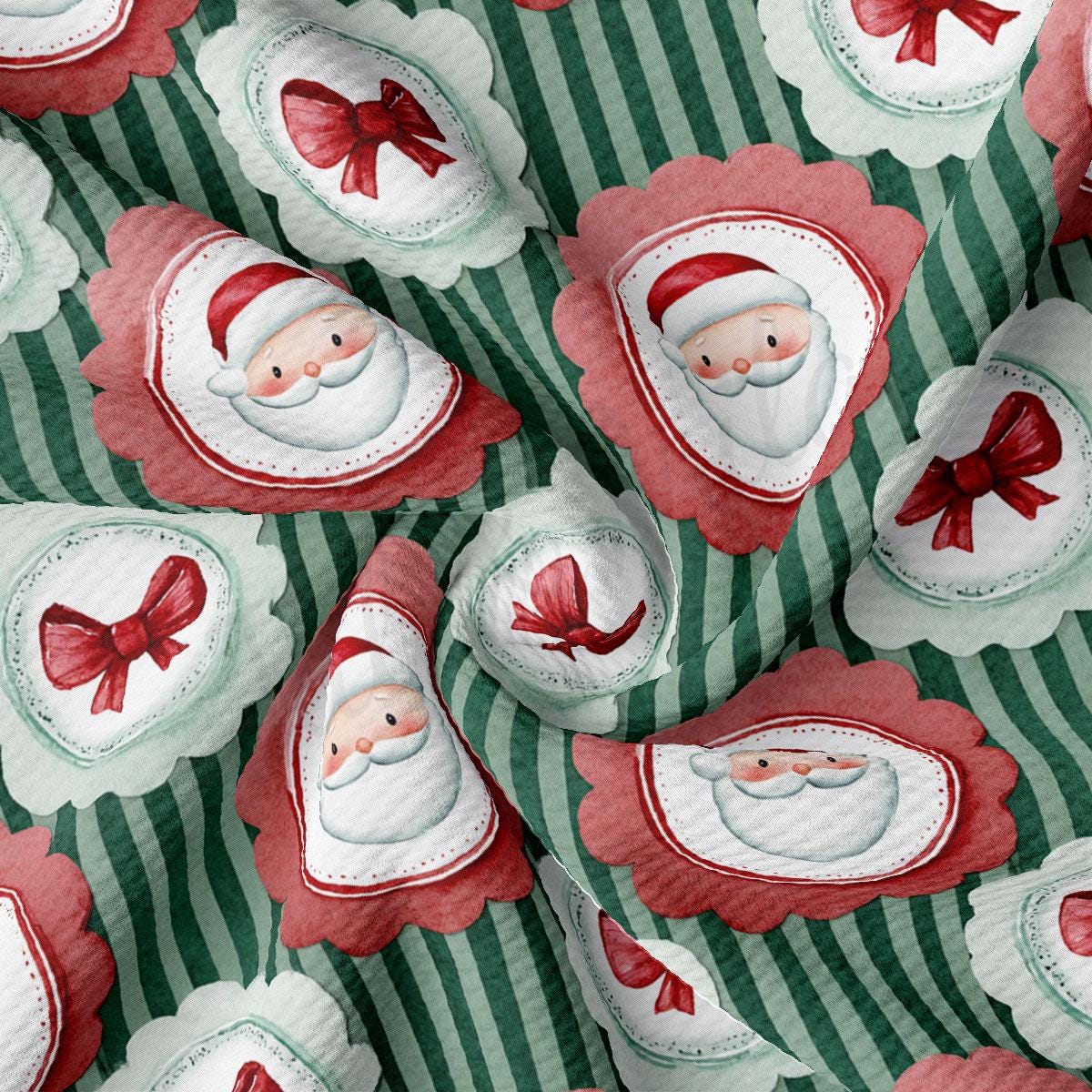 The image is a close-up of a fabric with a repeating pattern of Santa Claus and red bows on a green and white striped background.
