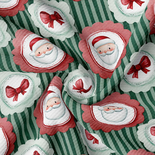 The image is a close-up of a fabric with a repeating pattern of Santa Claus and red bows on a green and white striped background.