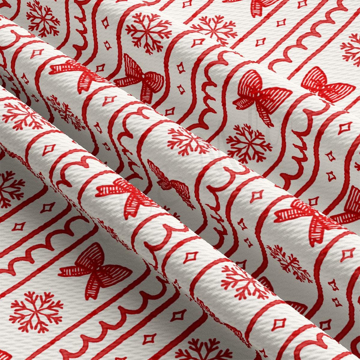 a close-up view of a fabric with a repeating pattern of red snowflakes and red bows.