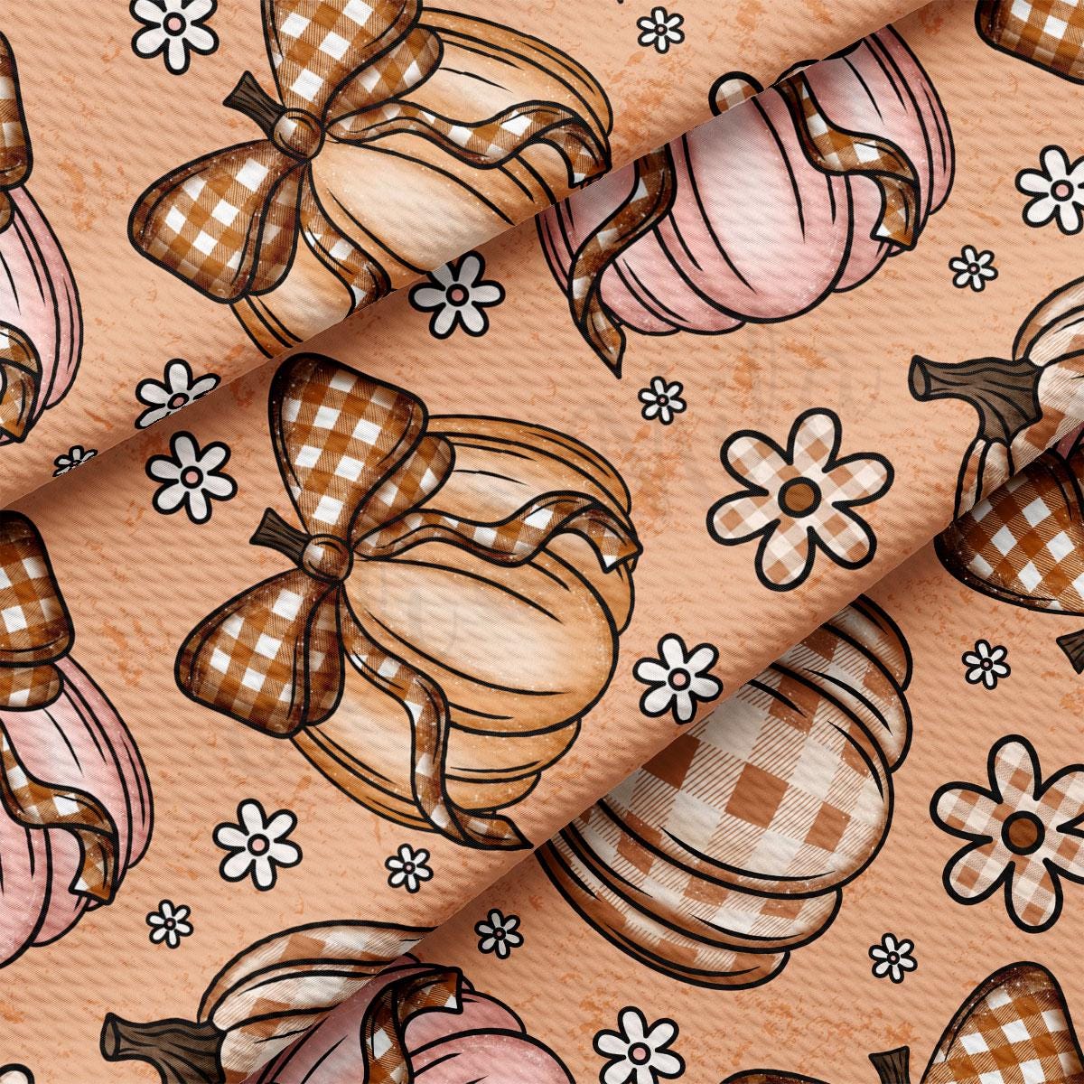 a repeating pattern of brown and white checkered bows and pumpkins, along with small white flowers scattered throughout the design.