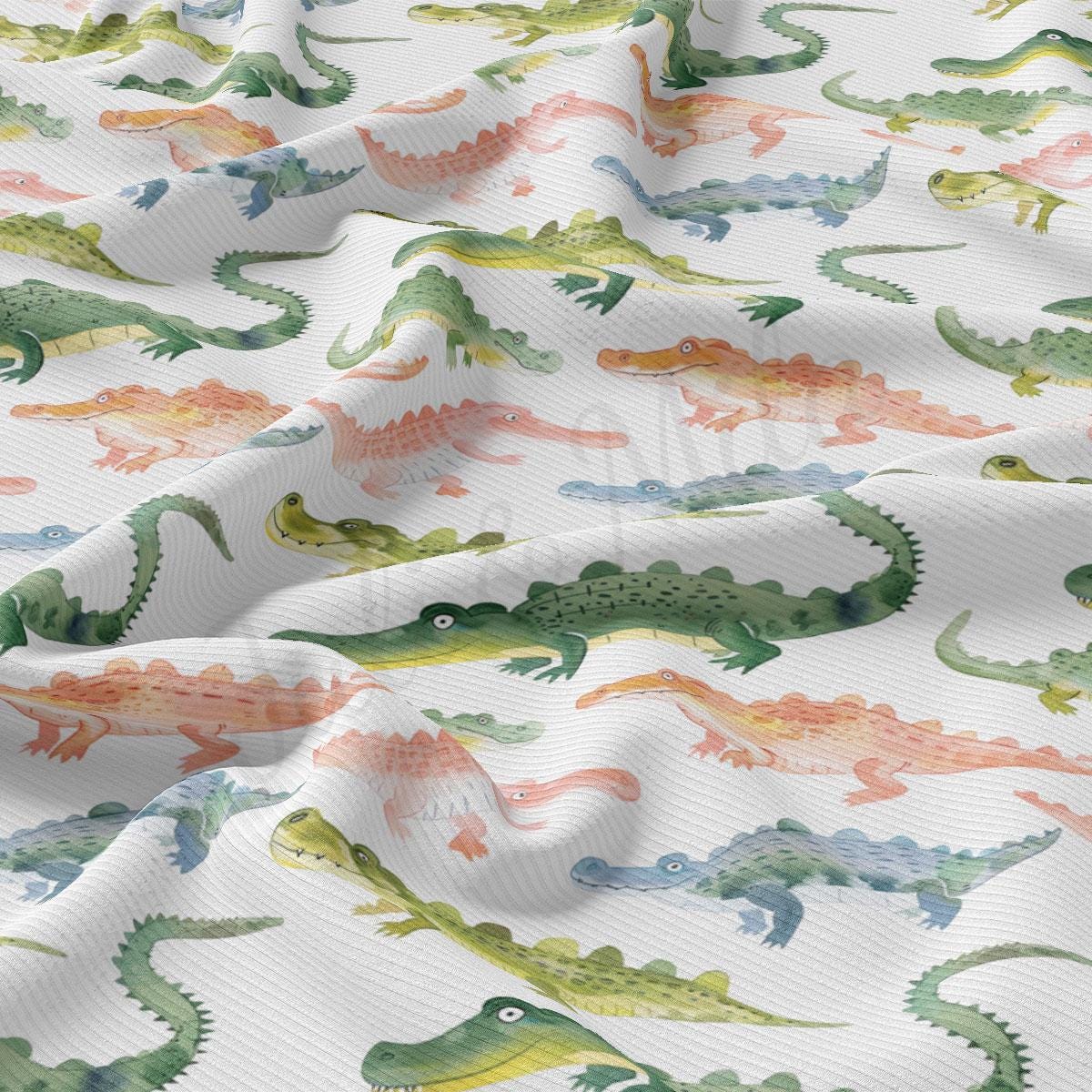 a close up of a pattern of alligators on a white background