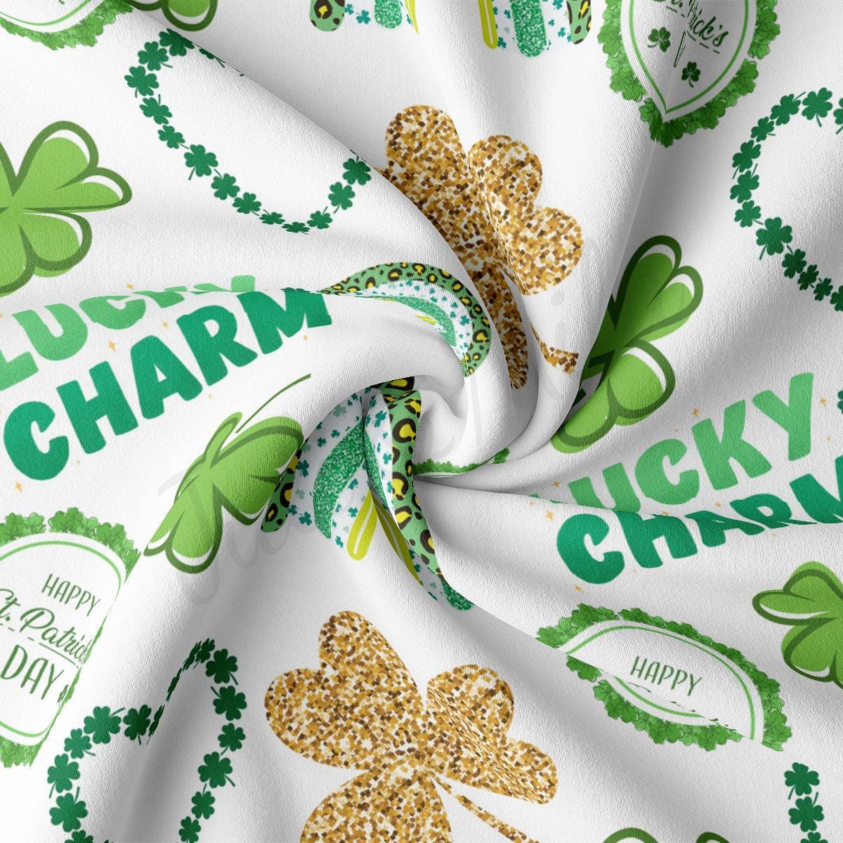 a close up of a white fabric with shamrocks on it