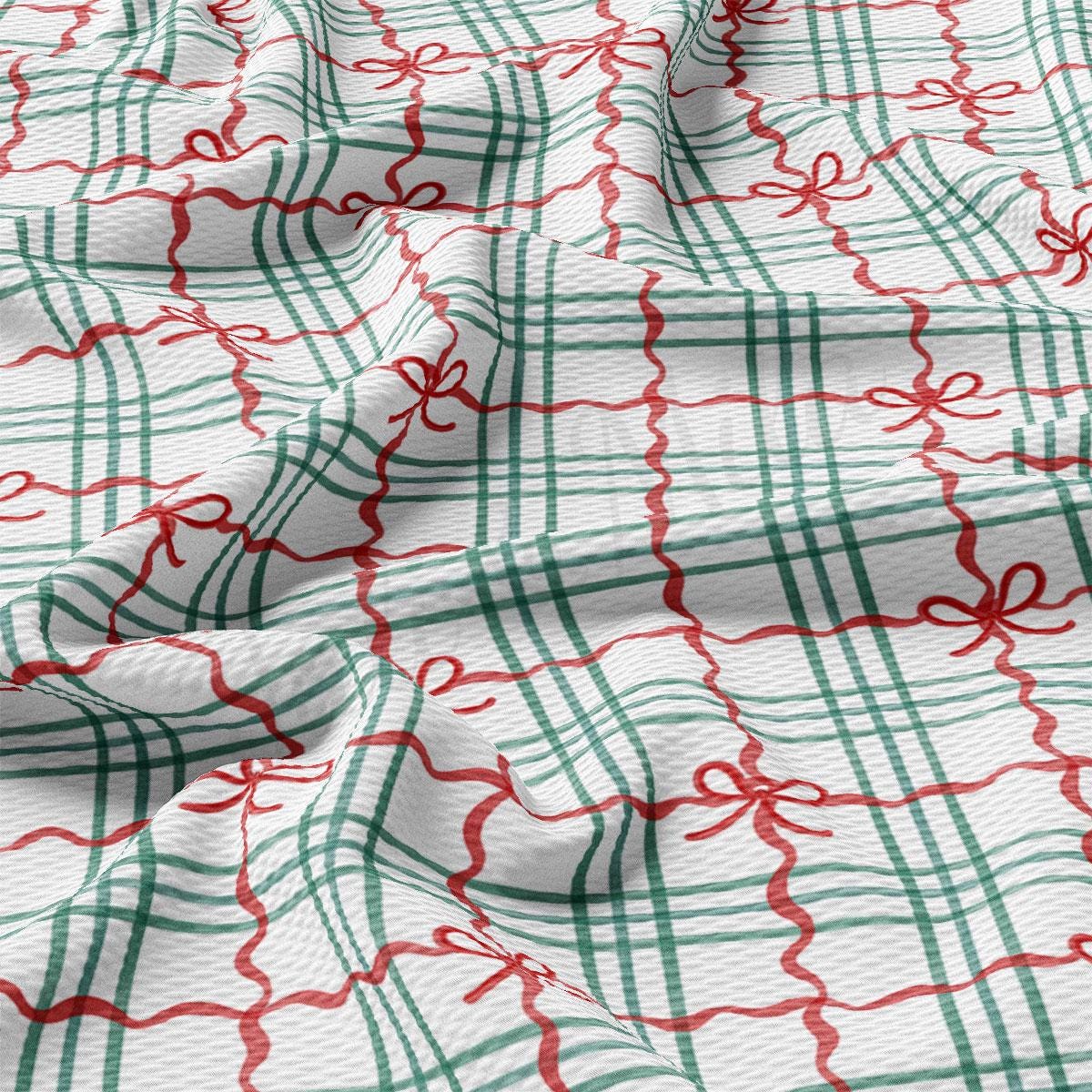 a close-up view of a fabric with a repeating pattern of green and red stripes, resembling a plaid or checkered design. The pattern is composed of diagonal lines, creating a sense of movement and texture. The fabric appears to be made of a soft, plush material, suitable for clothing or home decor.