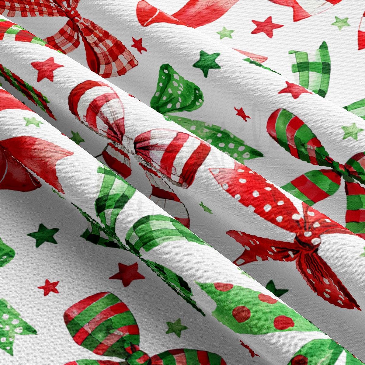 The image is a close-up view of a fabric with a repeating pattern of red and green polka dots, green stars, and red and green bows.