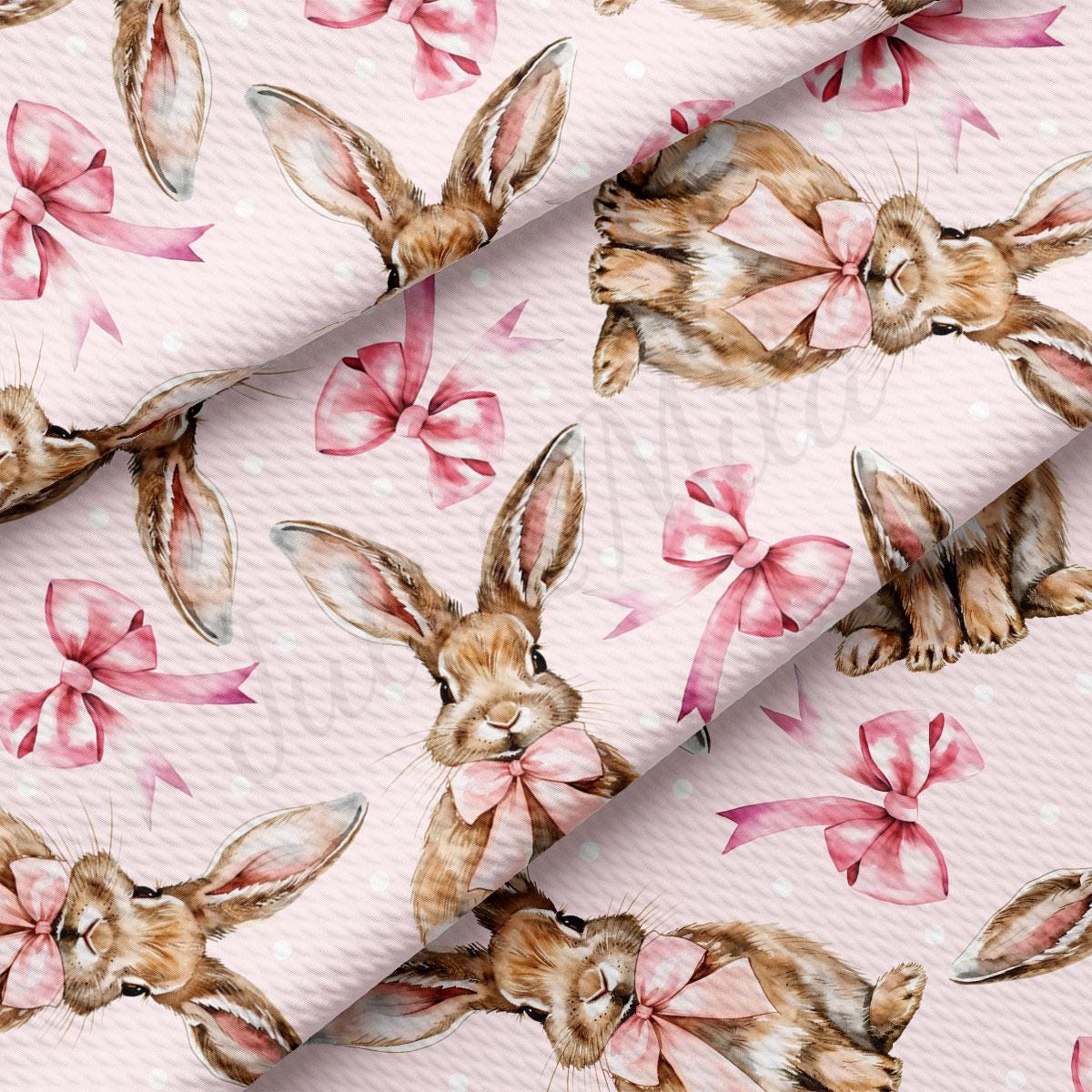 a pink background with a pattern of rabbits and bows