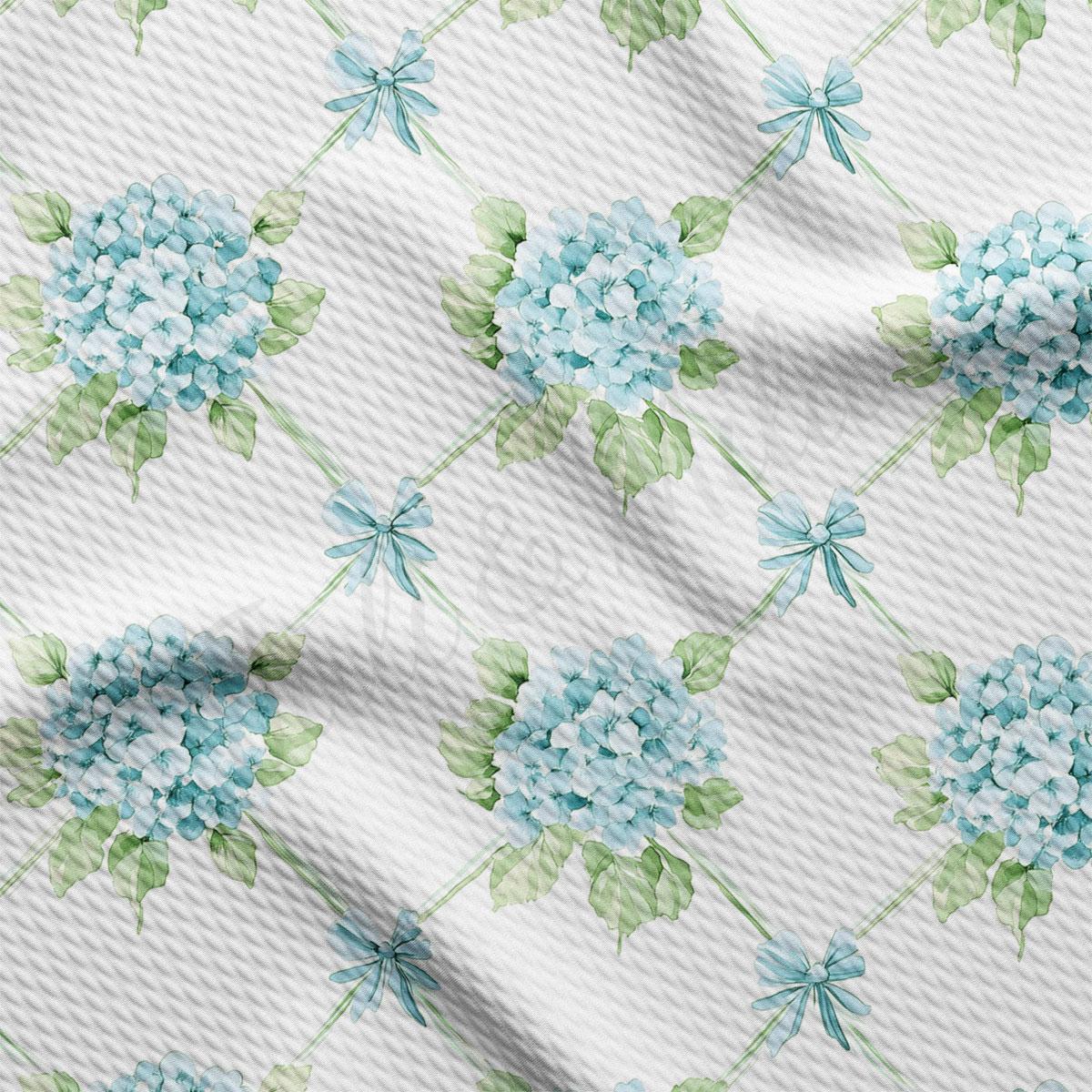 a repeating pattern of blue hydrangea flowers with green leaves, creating a visually appealing and harmonious design.