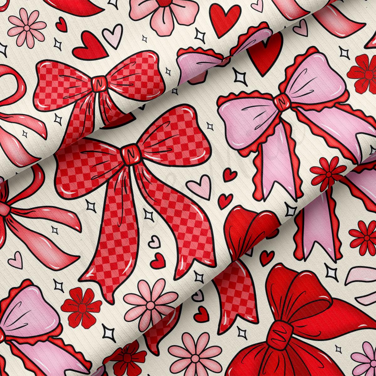 a pattern of red and pink bows, hearts, and flowers on a white background.