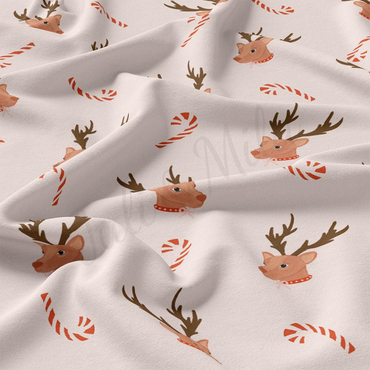 a white fabric with reindeers and candy canes on it