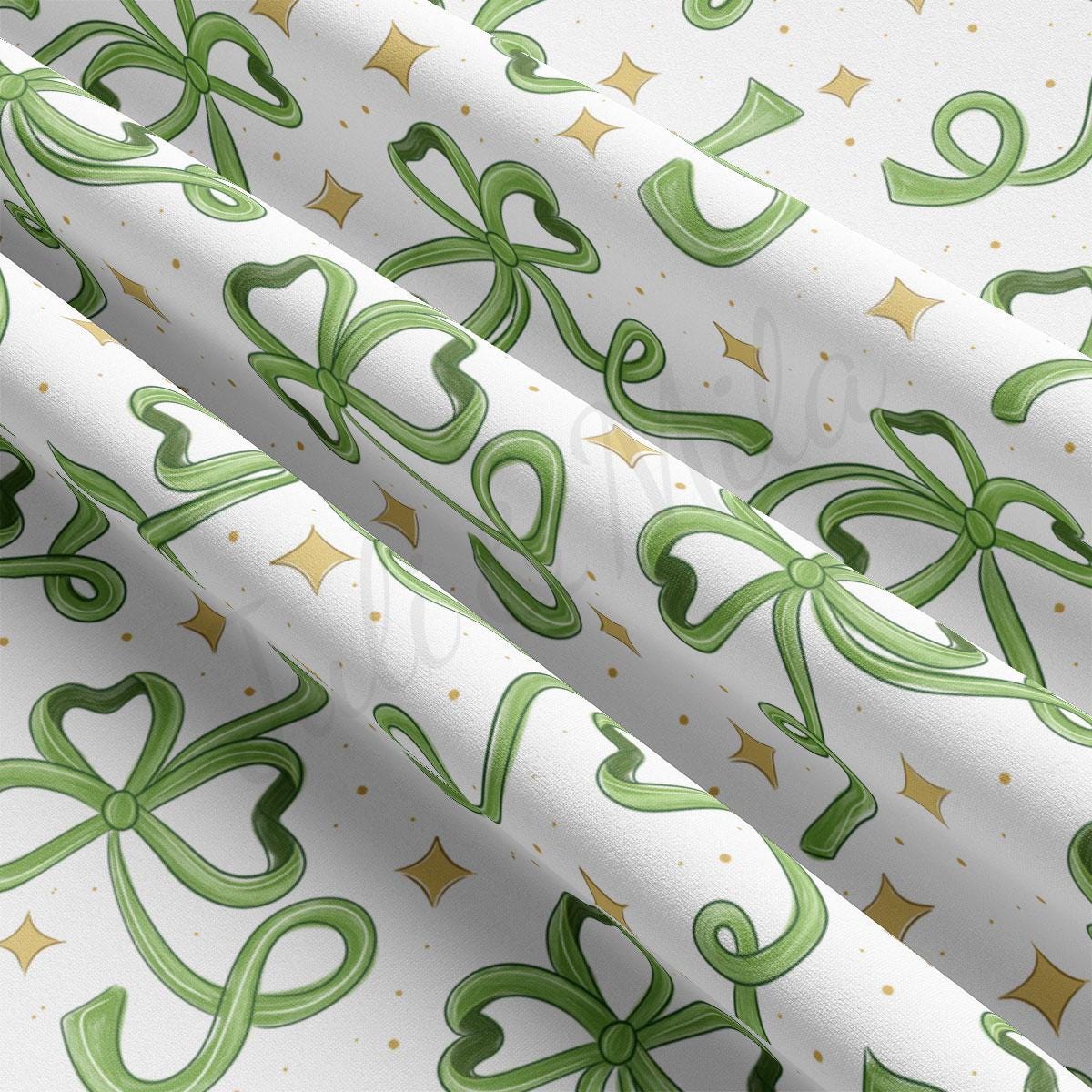 a white wrapping paper with green and gold designs