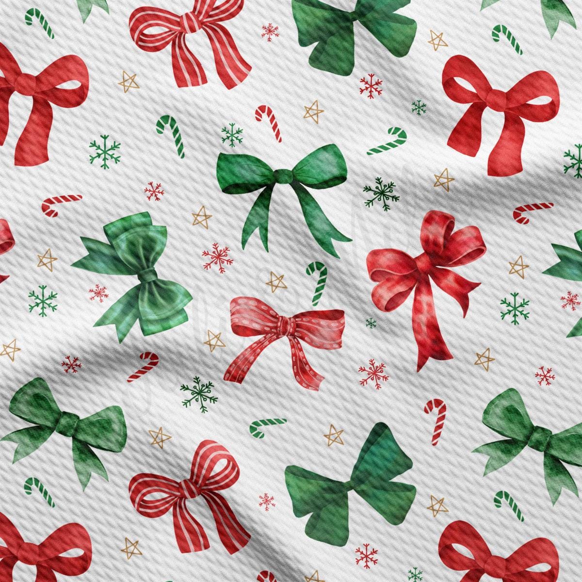 a pattern of red and green bows, candy canes, and snowflakes on a white background.