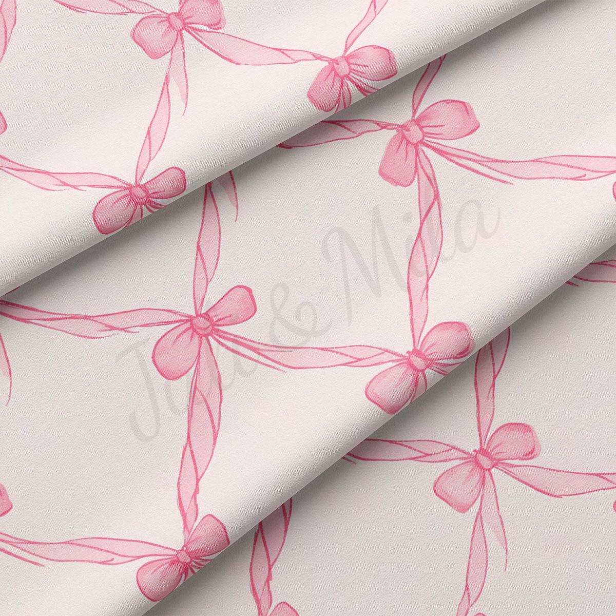 a repeating pattern of pink bows on a white background.