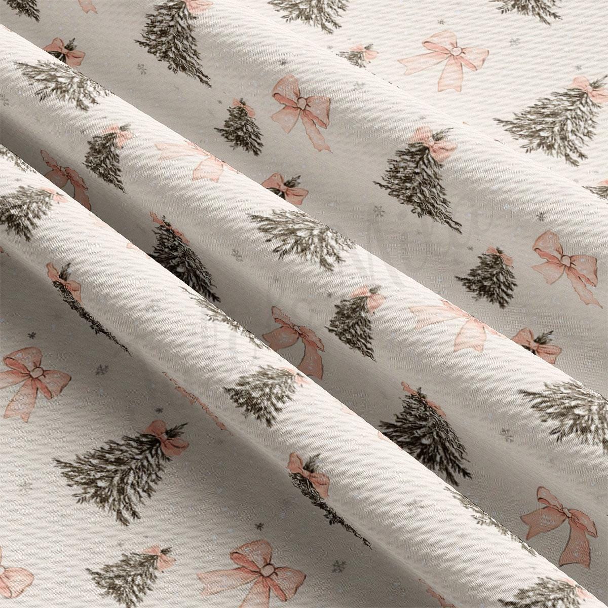 a repeating pattern of Christmas trees with pink bows on a white background.