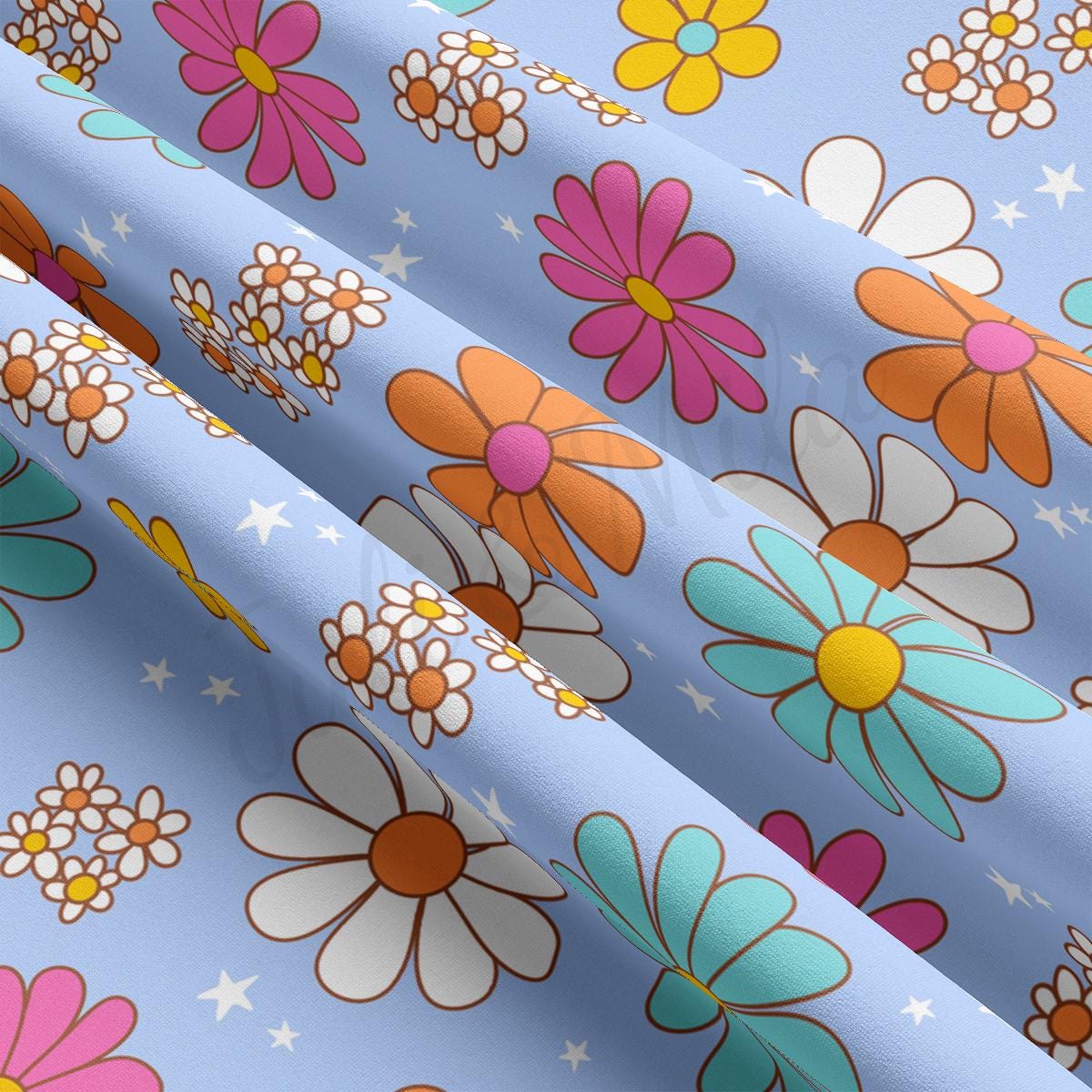 a blue background with flowers and stars on it