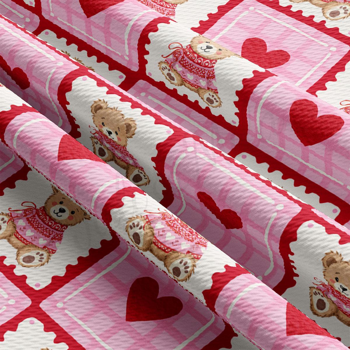 a close-up view of a fabric with a repeating pattern of pink and white teddy bears wearing red and white outfits, along with red hearts.