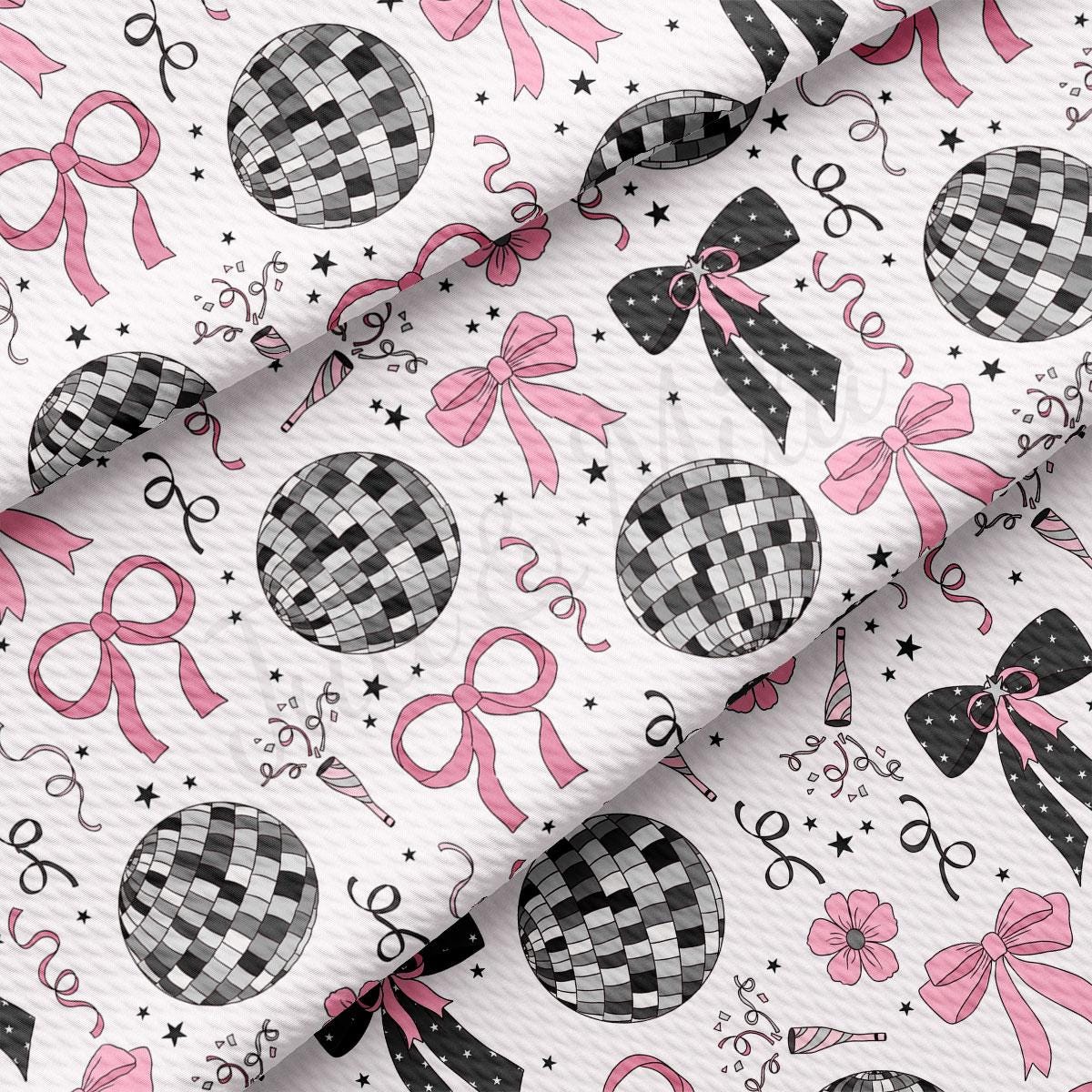 a white background with black and pink bows and ornaments