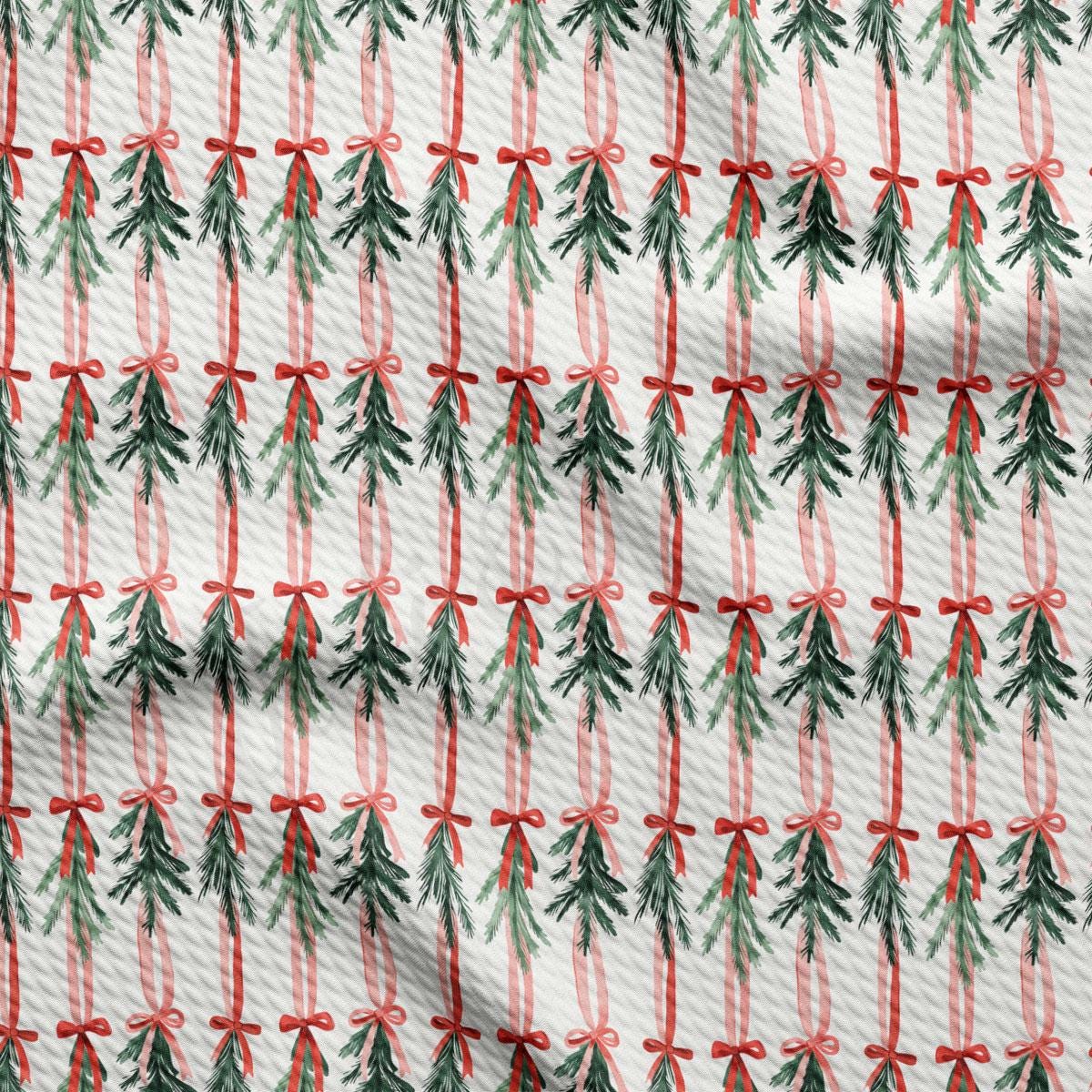 a repeating pattern of Christmas trees with red bows, creating a festive and holiday-themed design.