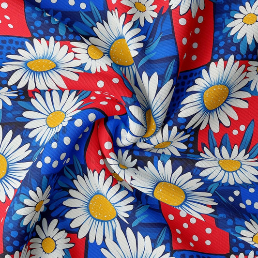 a red, white, and blue fabric with daisies on it