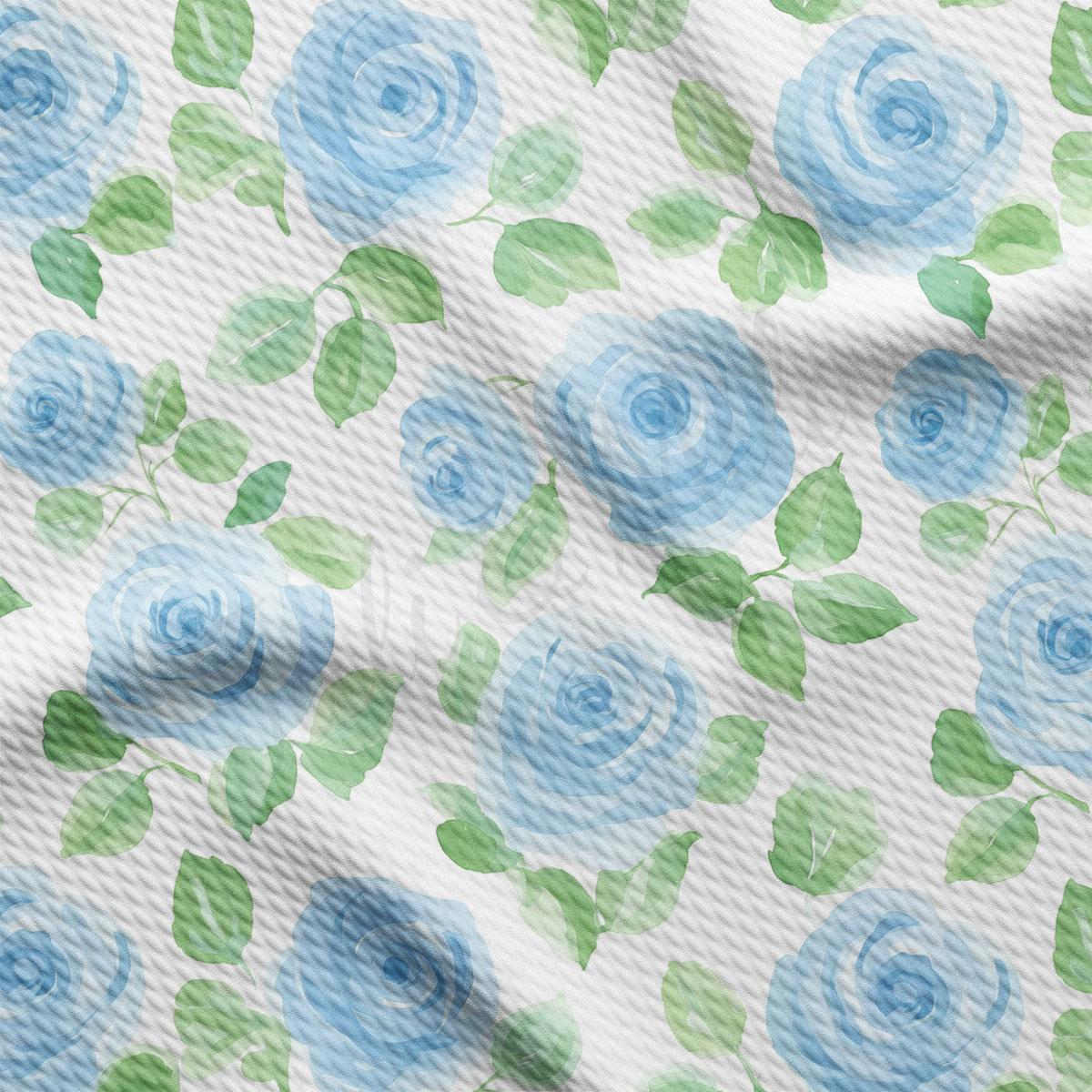a repeating pattern of blue roses and green leaves on a white background.