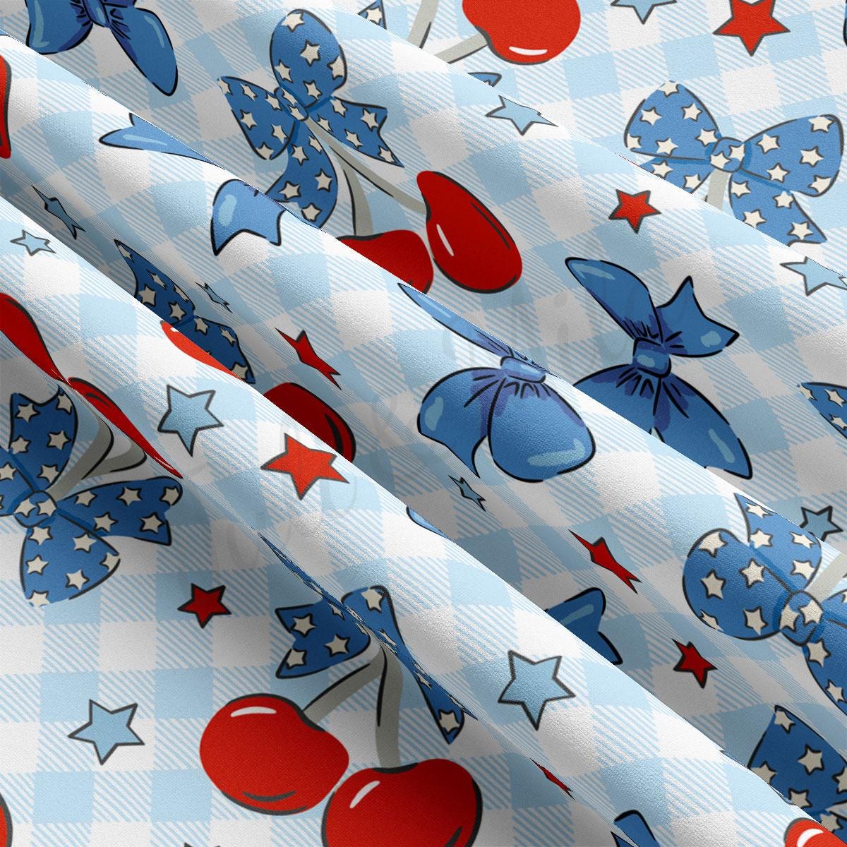 a blue and white checkered fabric with red, white, and blue cherries