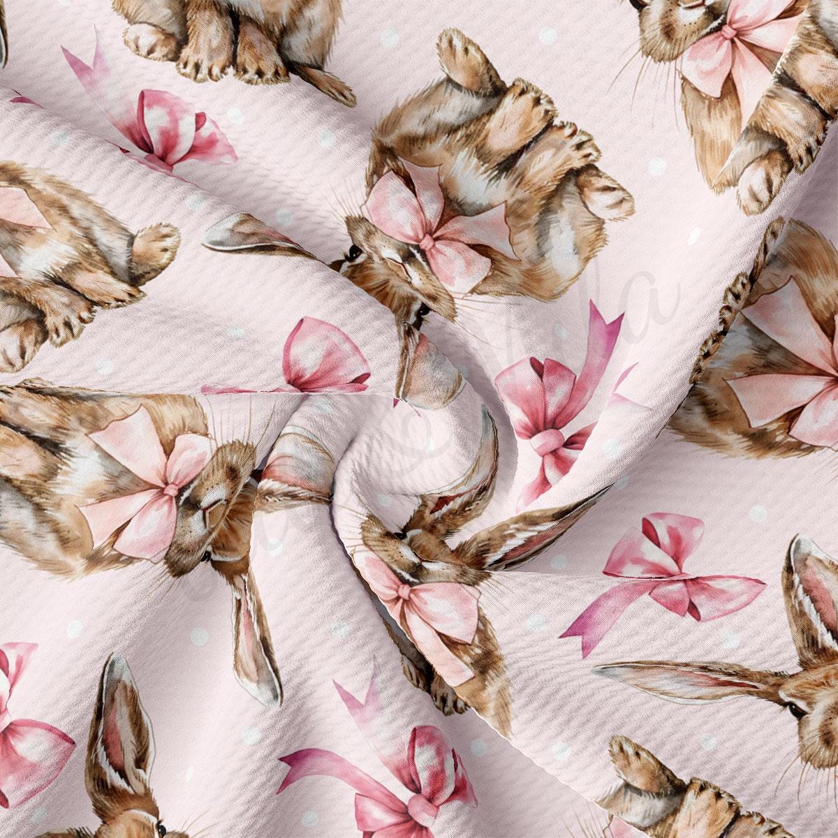 a cat with a bow on a pink background