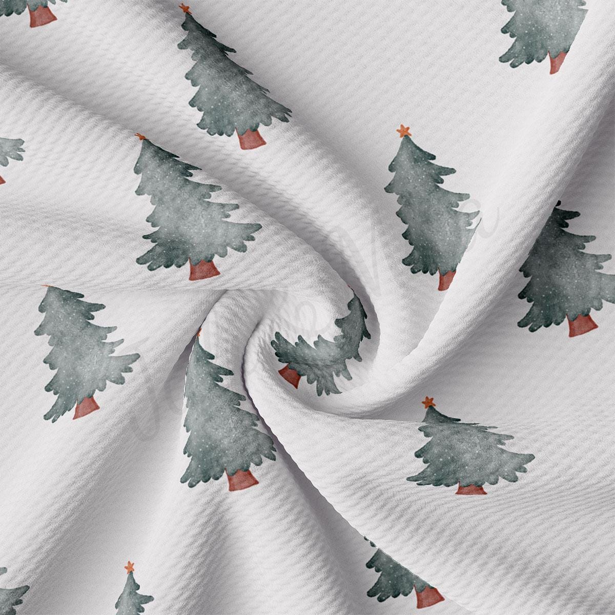 a white fabric with trees on it