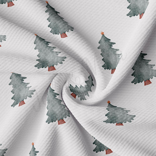 a white fabric with trees on it
