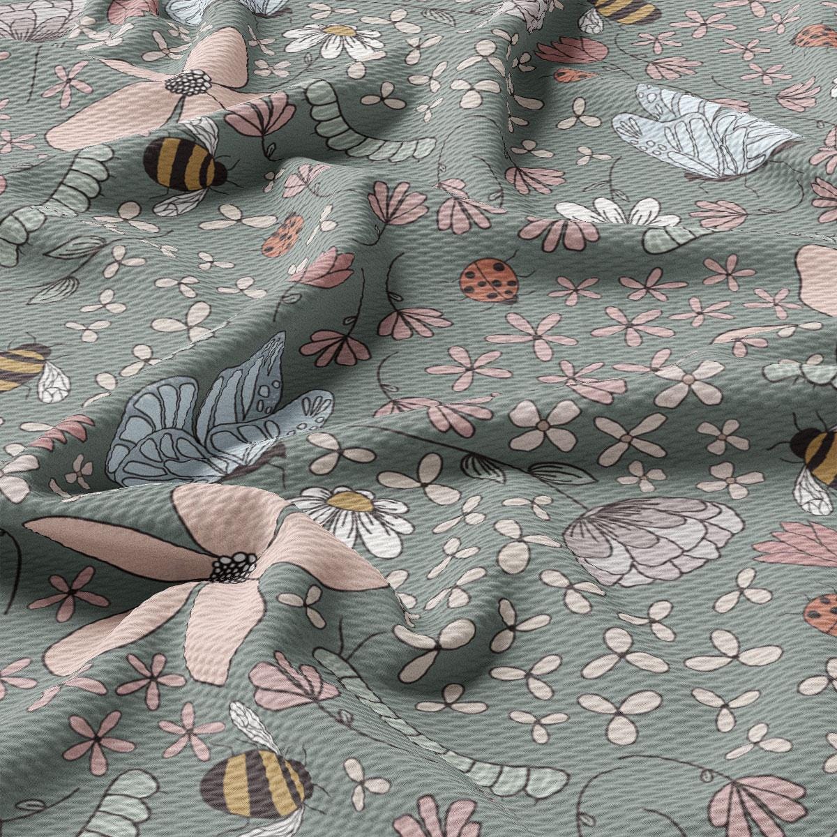 a close up of a flowery fabric with bees on it