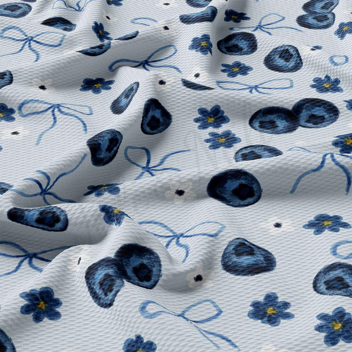 a close up of a blue and white floral print fabric