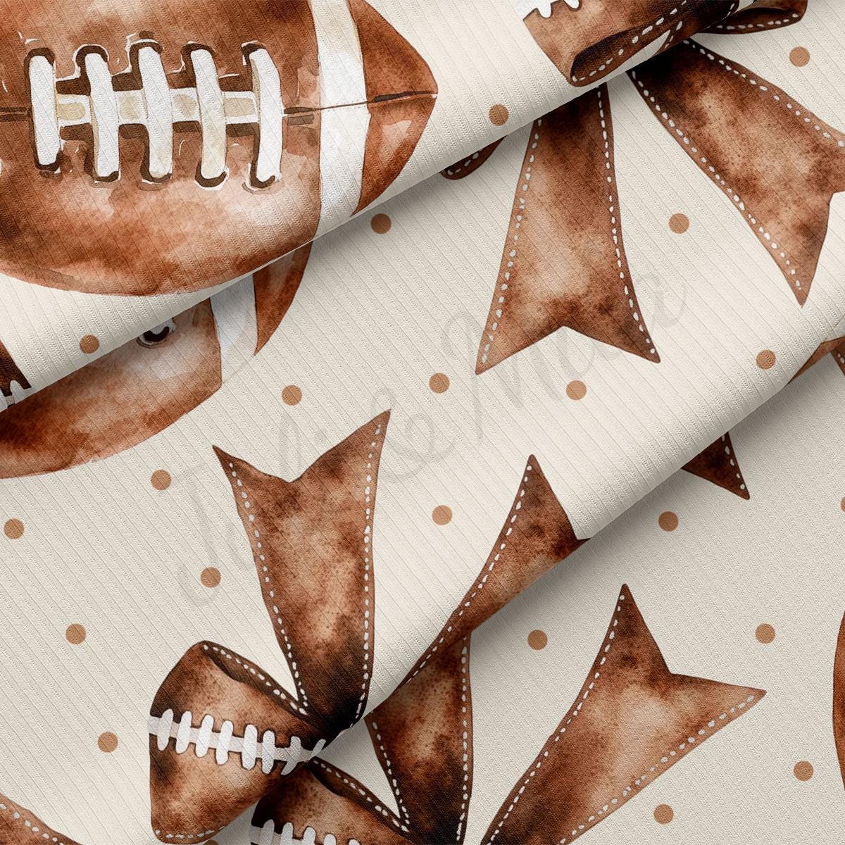 a close-up view of a fabric with a repeating pattern of brown footballs and brown polka dots.