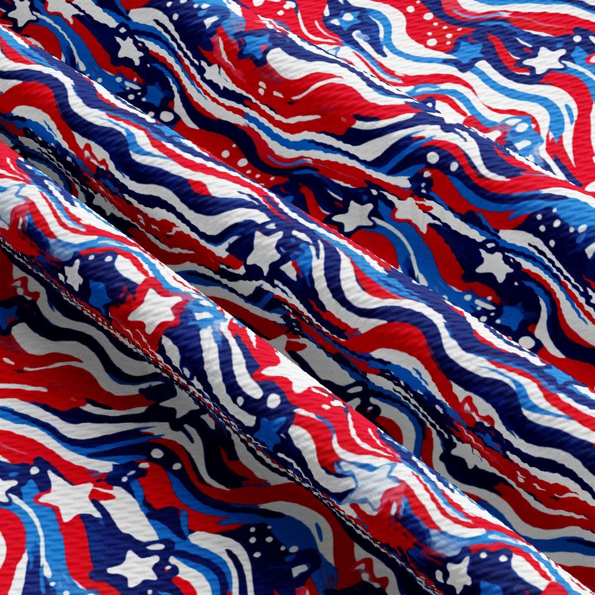 a red, white, and blue fabric with stars and swirls
