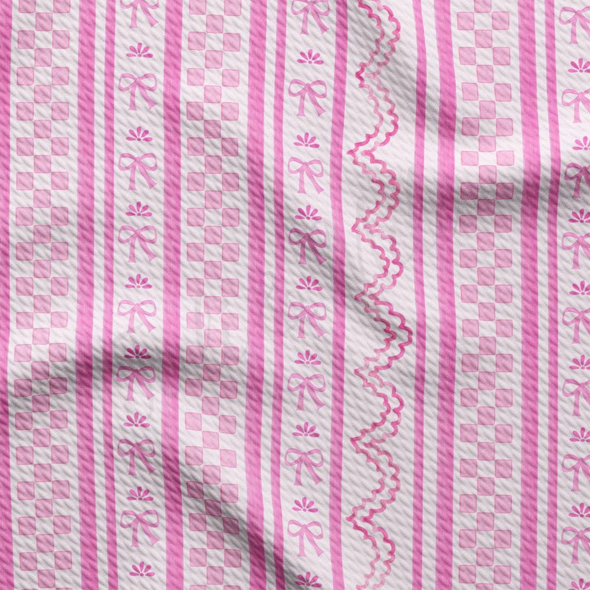 a close up of a pink and white fabric