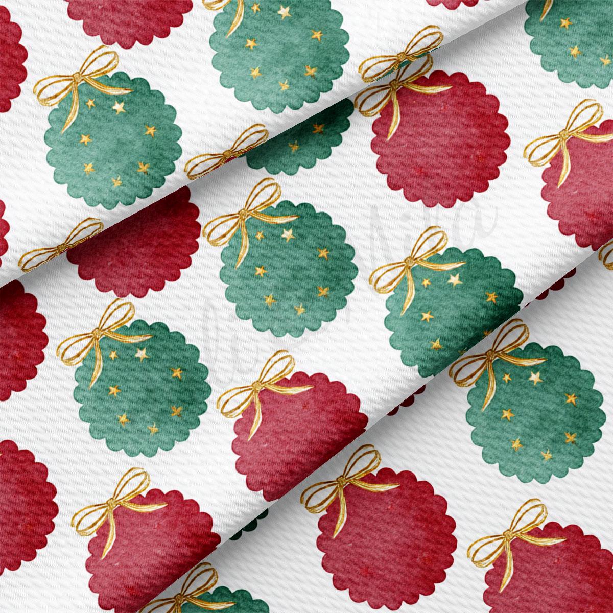 a repeating pattern of Christmas ornaments in red and green colors, adorned with gold bows.