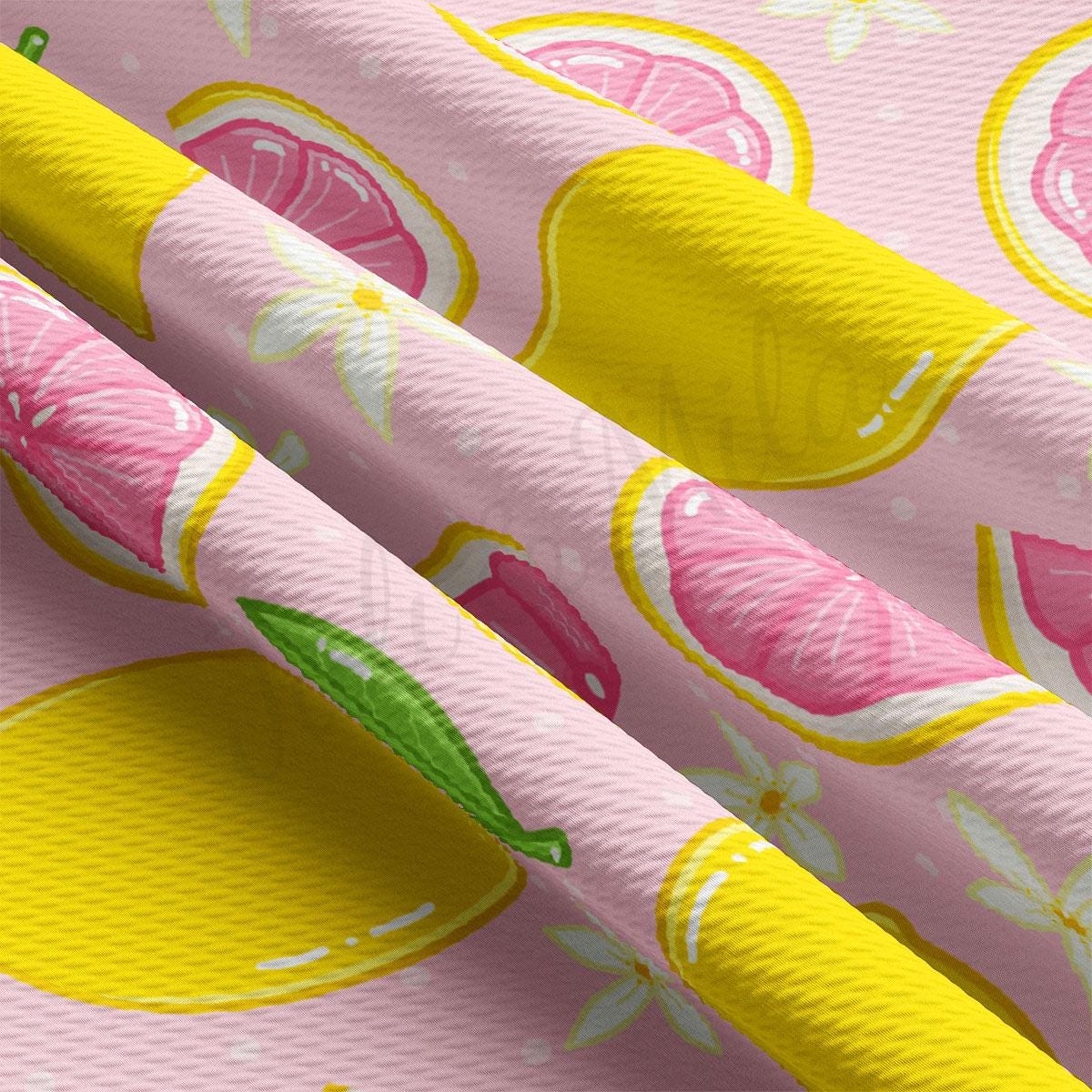 a pink and yellow wallpaper with lemons and grapefruits