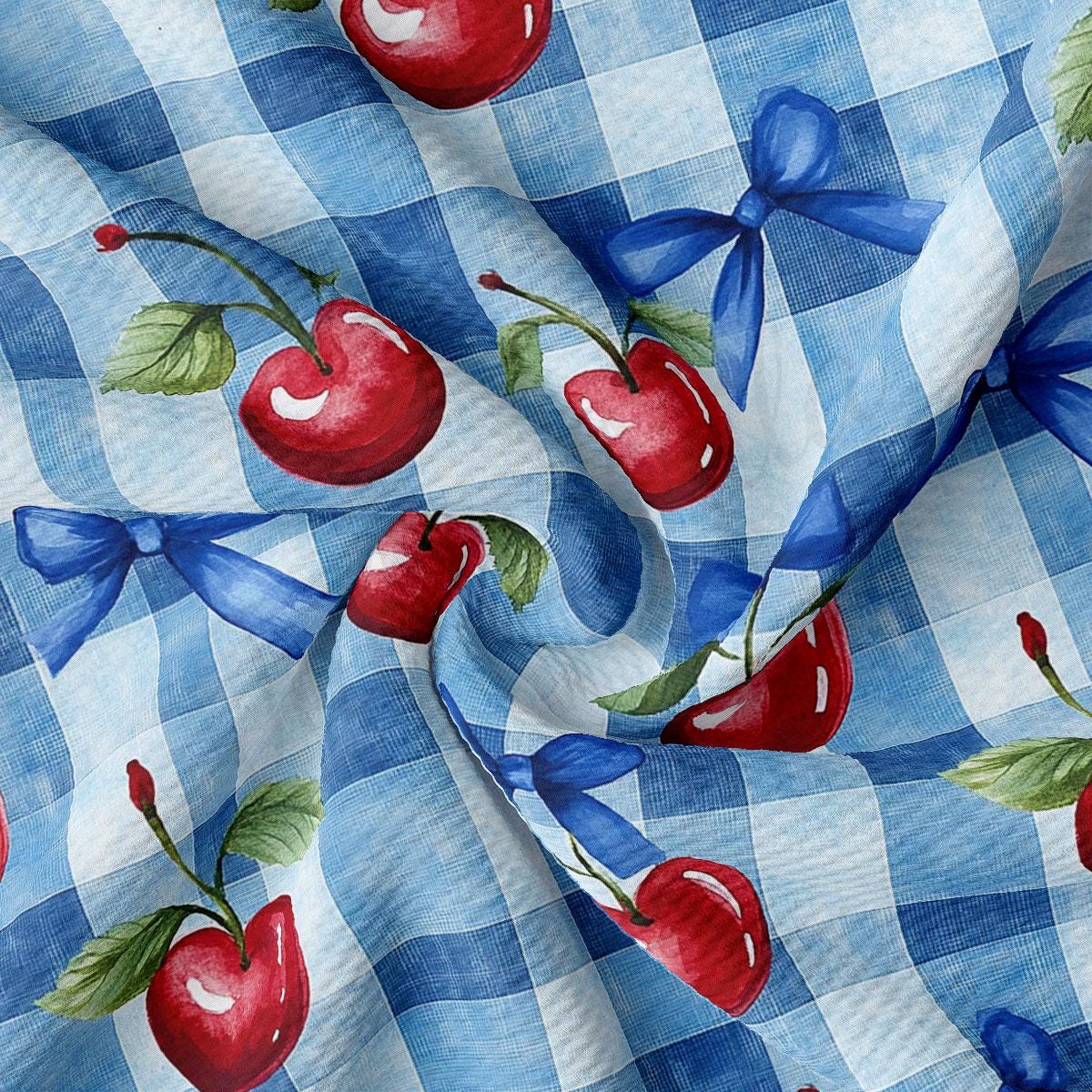 a blue and white checkered fabric with cherries on it