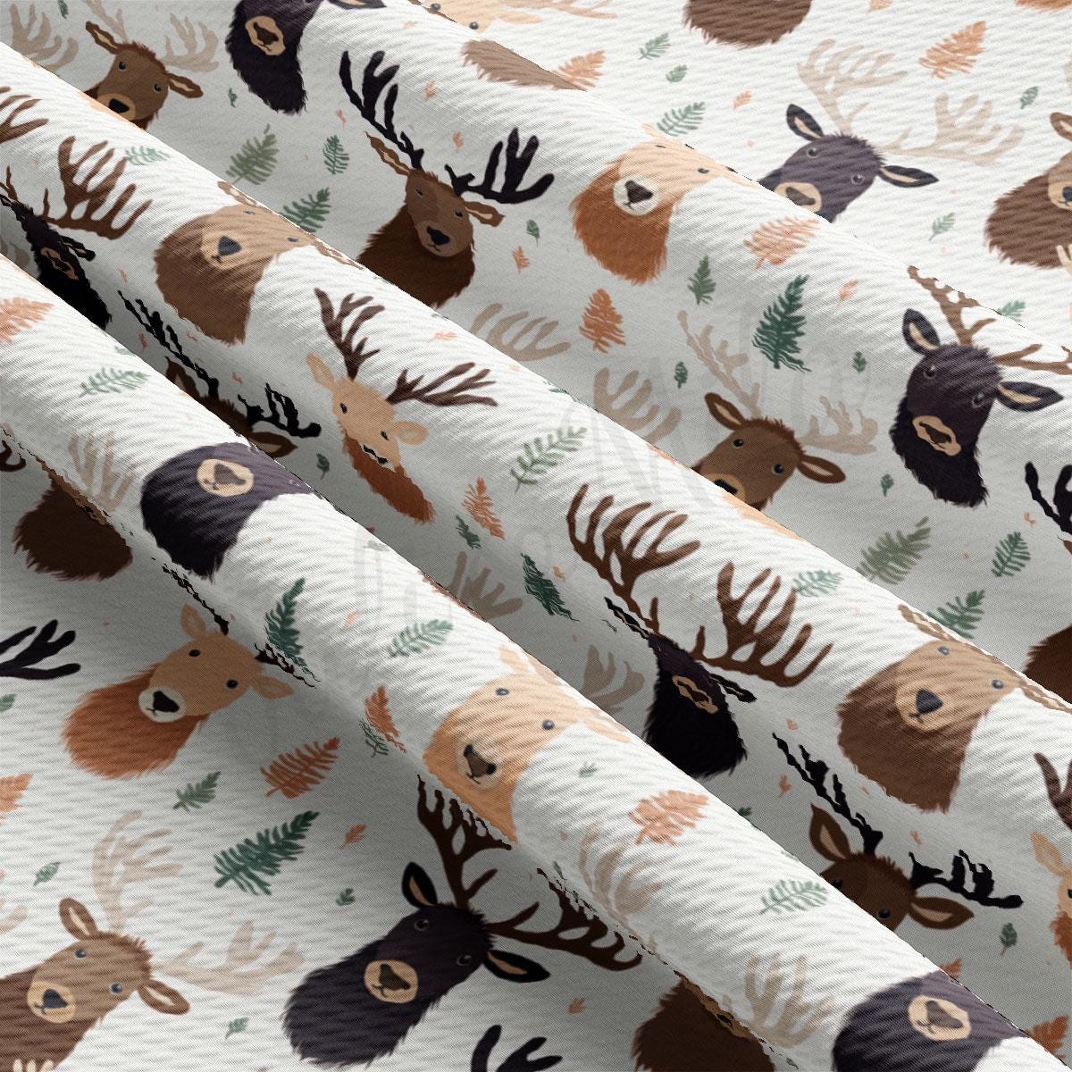 a close up of a pattern of deer on a white background