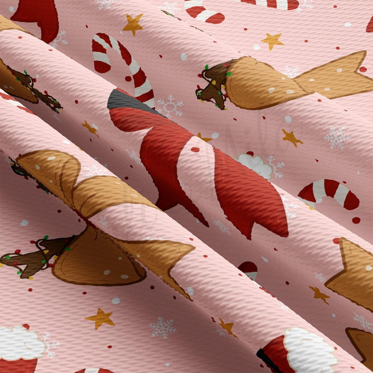 a close-up view of a fabric with a repeating pattern of Christmas-themed elements, including candy canes, snowflakes, and reindeer.