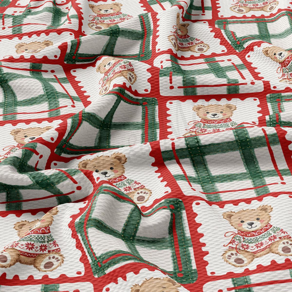 The image is a close-up of a fabric with a repeating pattern of teddy bears wearing Christmas sweaters. The pattern consists of green and red plaid squares, each containing a teddy bear wearing a sweater. The teddy bears are arranged in a grid-like pattern, creating a festive and holiday-themed design.