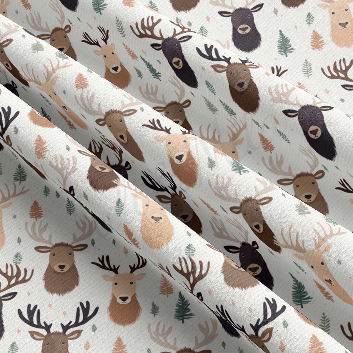 a pattern of deer and pine trees on a white background