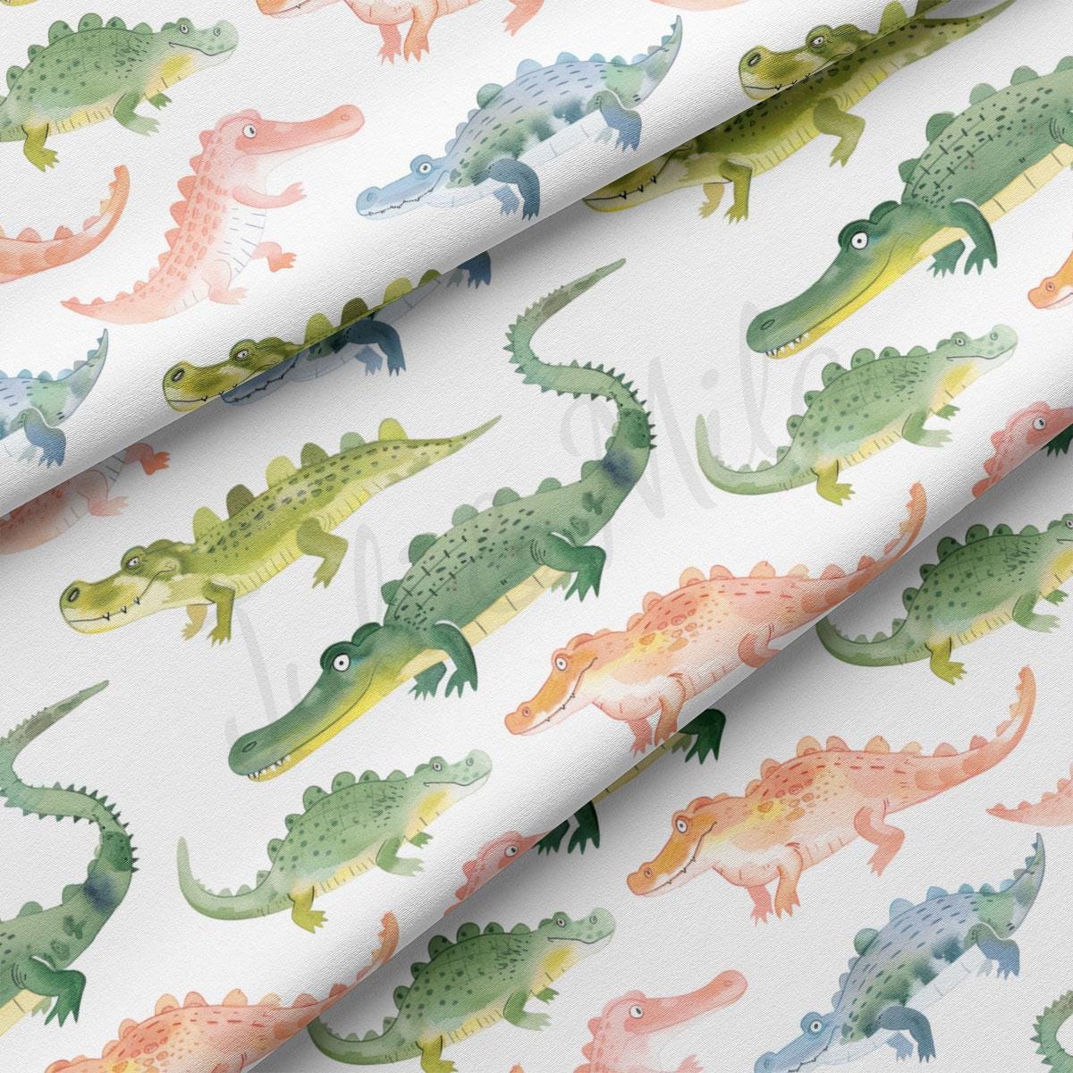 a close up of a pattern of alligators on a white background