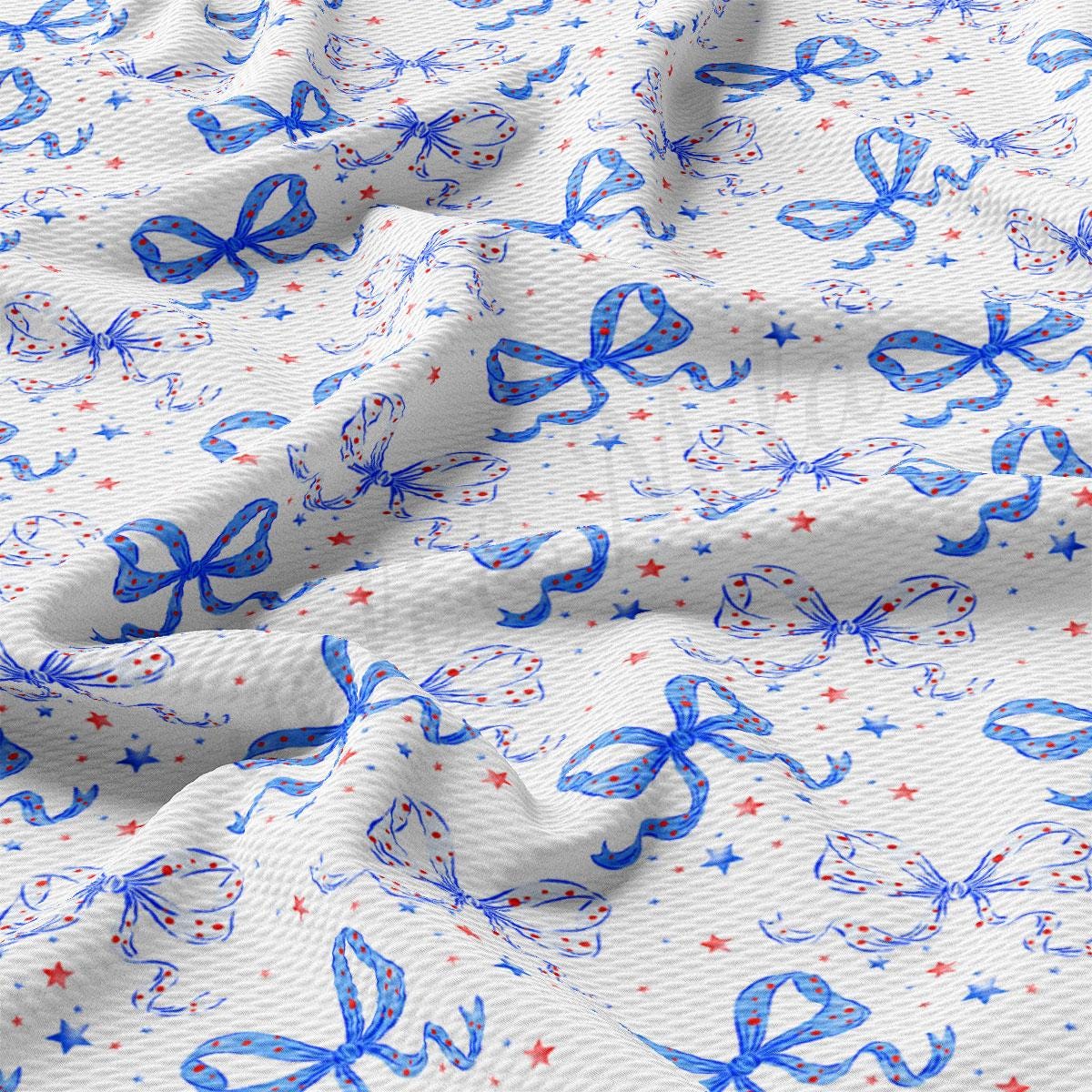 a close up of a white fabric with blue and red designs