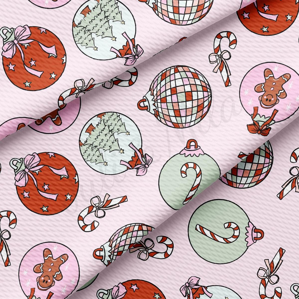 a pink background with christmas ornaments on it