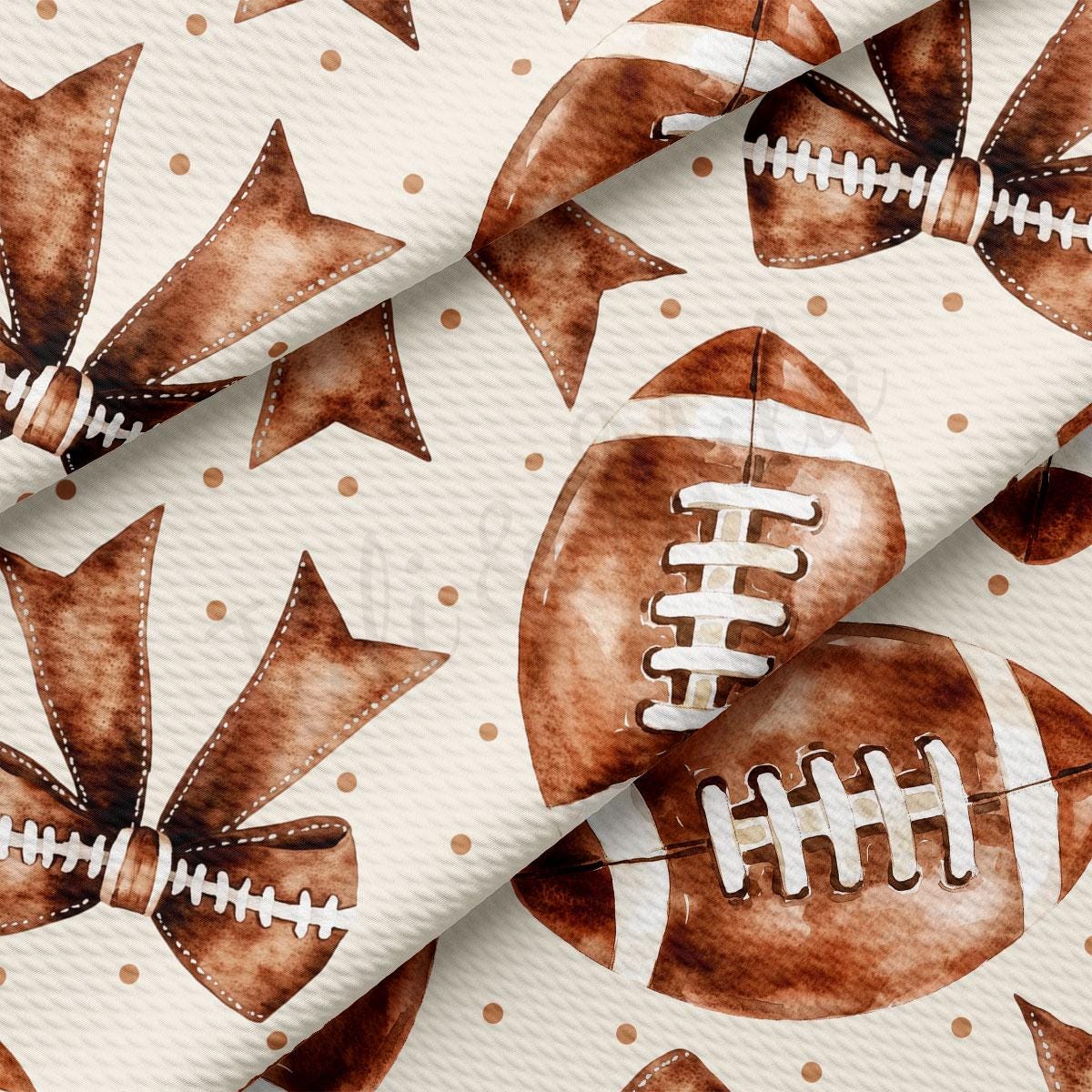 a close-up view of a fabric with a repeating pattern of brown footballs and brown bows.