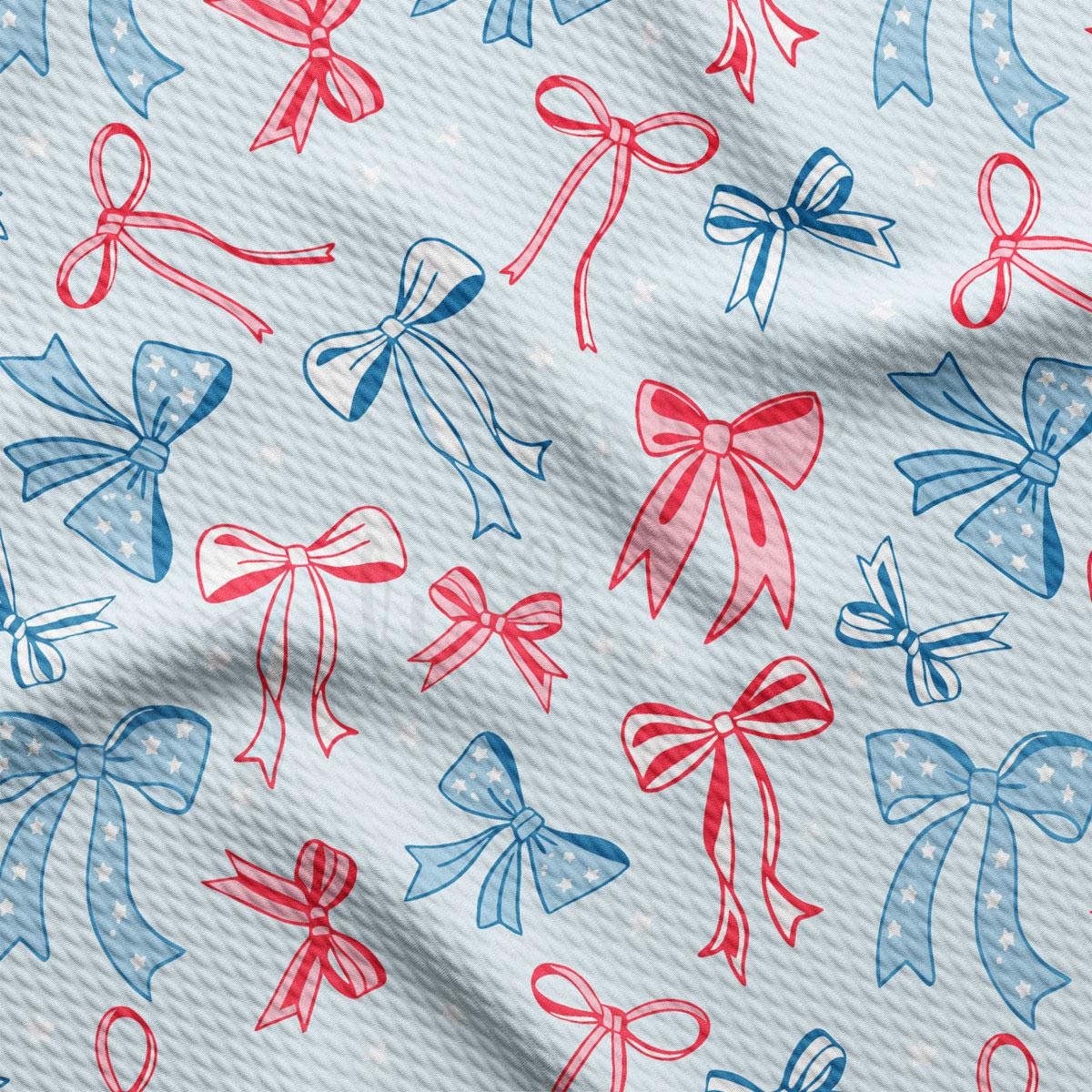 a close up of a pattern of bows on a blue background