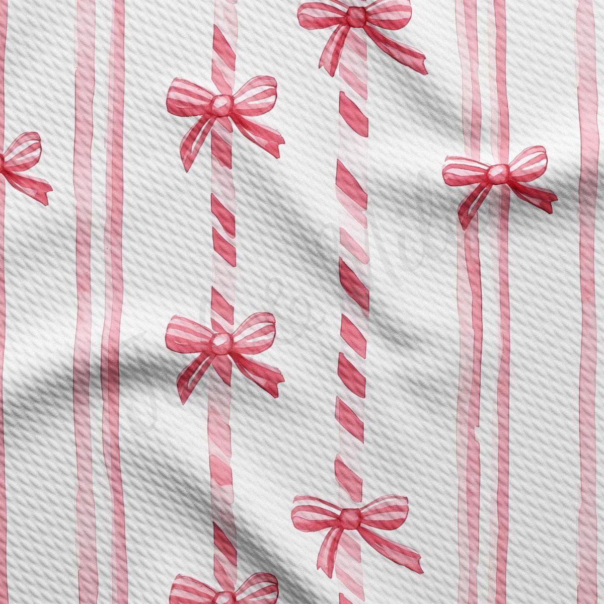 a repeating pattern of red bows on a white background, with the bows appearing to be made of fabric or paper.